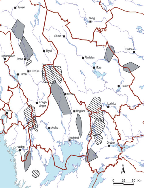 Figur 3.6 Utbredelsen av familiegrupper av ulv (grå felter)
og revirmarkerende par (skravering) i Skandinavia vinteren 2002–2003.