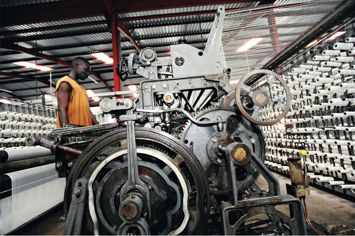 Figure 4.3 Although Africa is still lagging behind Asia and Latin America, more industrial jobs are being created in Africa as well. This enterprise in Tanzania manufactures fishing nets.