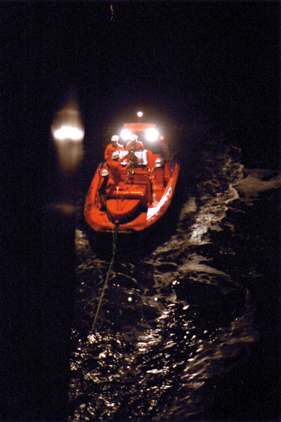 Figure 11.2 Lowering RIB and crew from the Coast Guard vessel KV Senja for a fisheries inspection. 