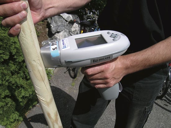 Figure 11.2 Measuring the heavy metal content of impregnated timber