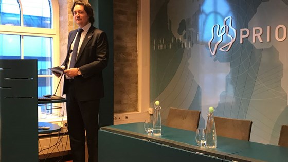 State Secretary Jens Frølich Holte speaks at the launch of the report Pathways to Peace. Credit: Prio
